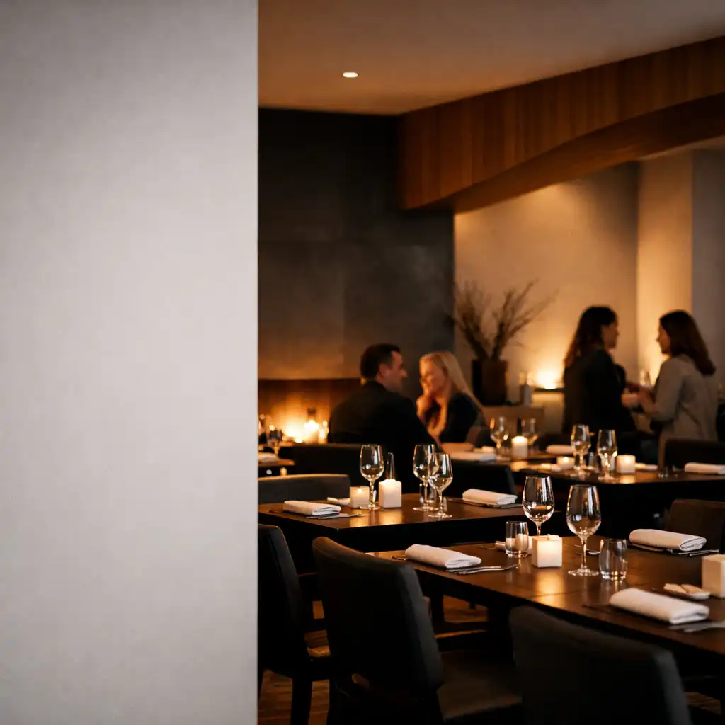 Dining room at The Grand Hearth with tables and guests in conversation